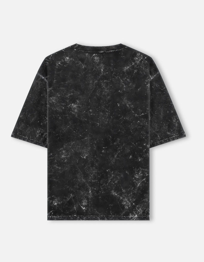 Black marble-textured t-shirt on a light gray background